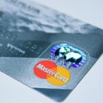 Detail shot of a MasterCard credit card, showing the chip and logo.