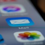 Detailed close-up of an email app icon on a smartphone screen, showcasing modern technology.