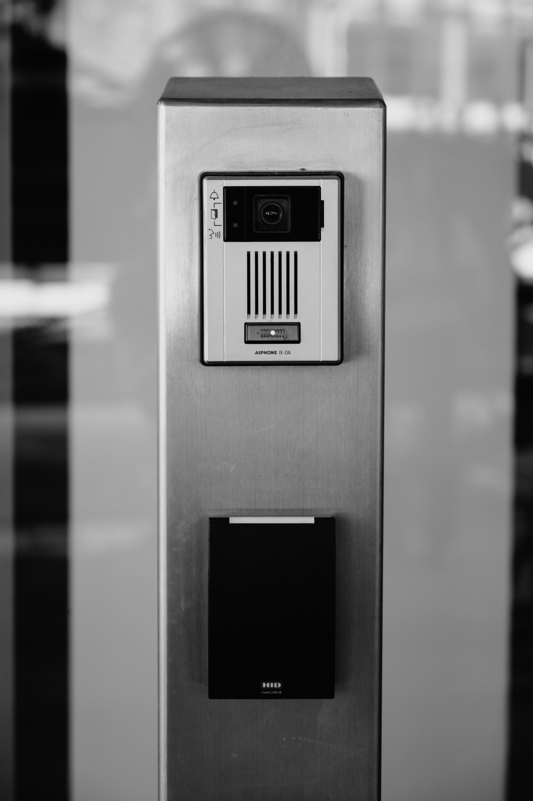 Minimalist black and white photo of an intercom system on a building facade in Boise.